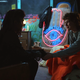 “Spiritual advisor” reads the sign behind Kali (Linnea Berthelsen) and El (Millie Bobby Brown) (Screenshot: Stranger Things)